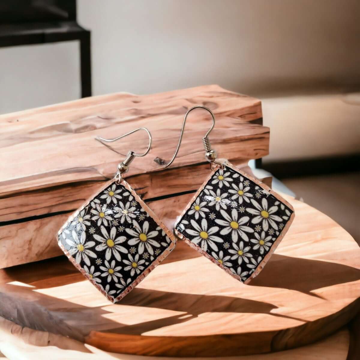Front view of handcrafted floral daisy copper square earrings