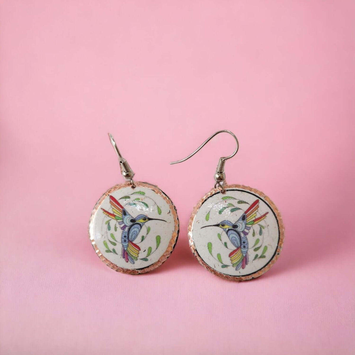 Close-up of the copper texture on handcrafted hummingbird copper circle earrings