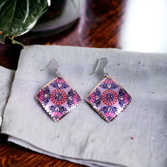 Front view of handcrafted artisan pink copper square earrings