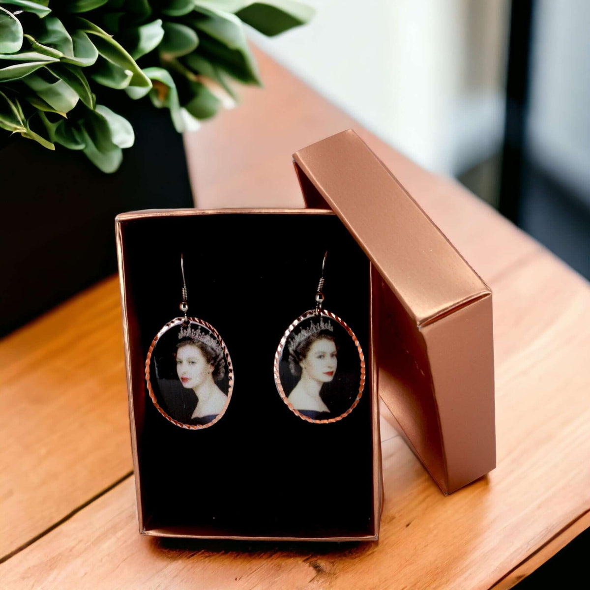 Front view of artisan Queen Elizabeth II copper oval earrings