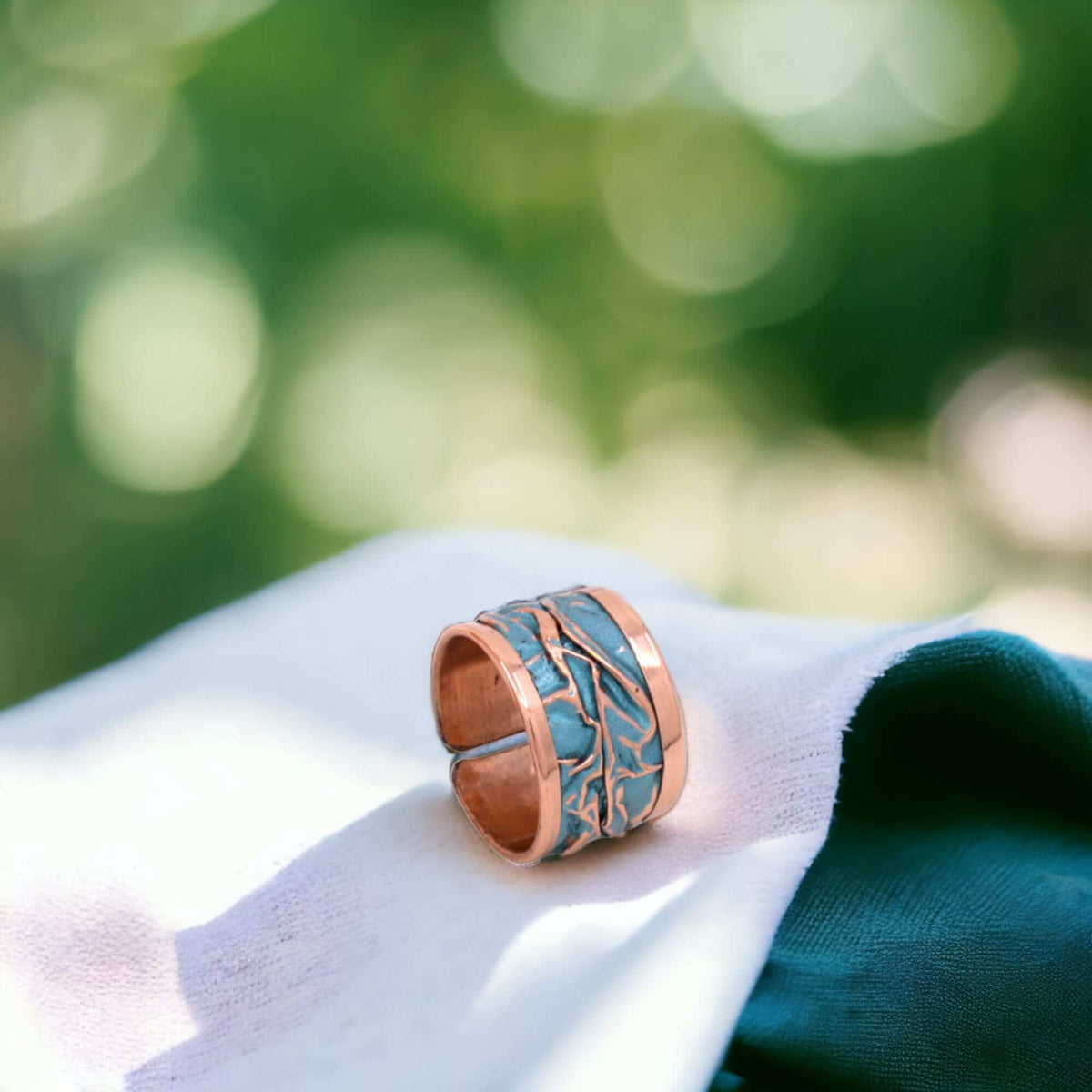 Front view of turquoise wrinkled copper adjustable ring