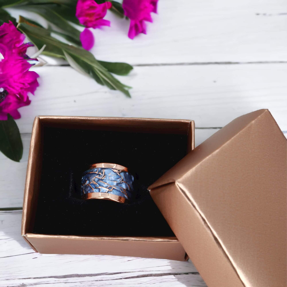 Front view of handmade blue wrinkled copper adjustable ring