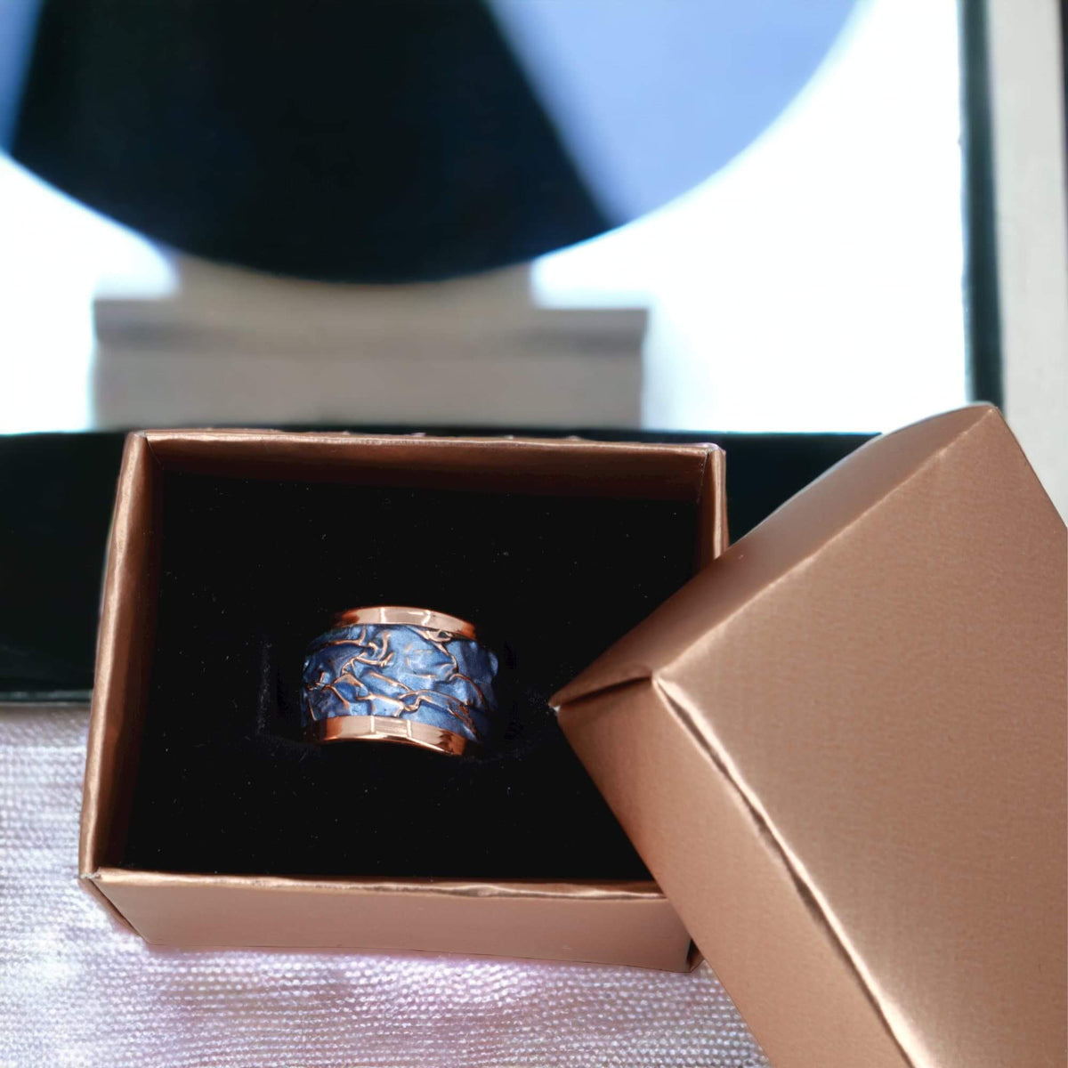 Handmade blue wrinkled copper adjustable ring worn on the finger