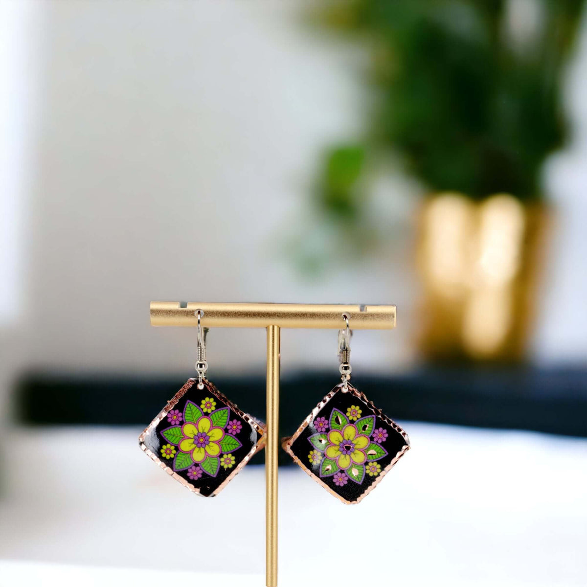 Handcrafted square yellow flower copper earrings worn on the ear