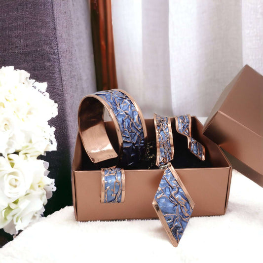 The full handcrafted blue wrinkled copper jewellery set laid flat