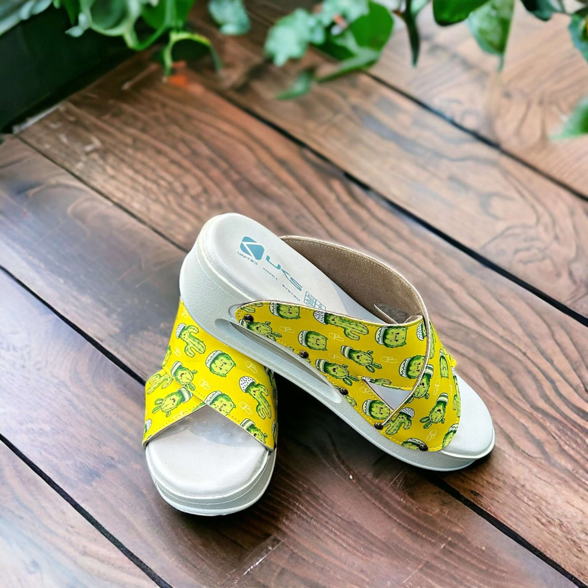 Front view of cactus print cross band leather clog slippers with an Air Clogx sole
