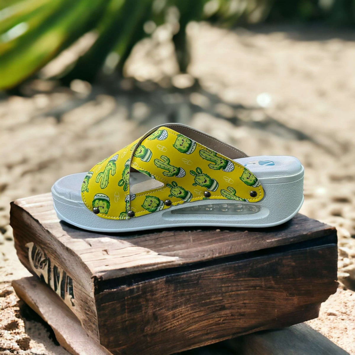 Cactus print cross band leather clog slippers with an Air Clogx sole worn on the foot