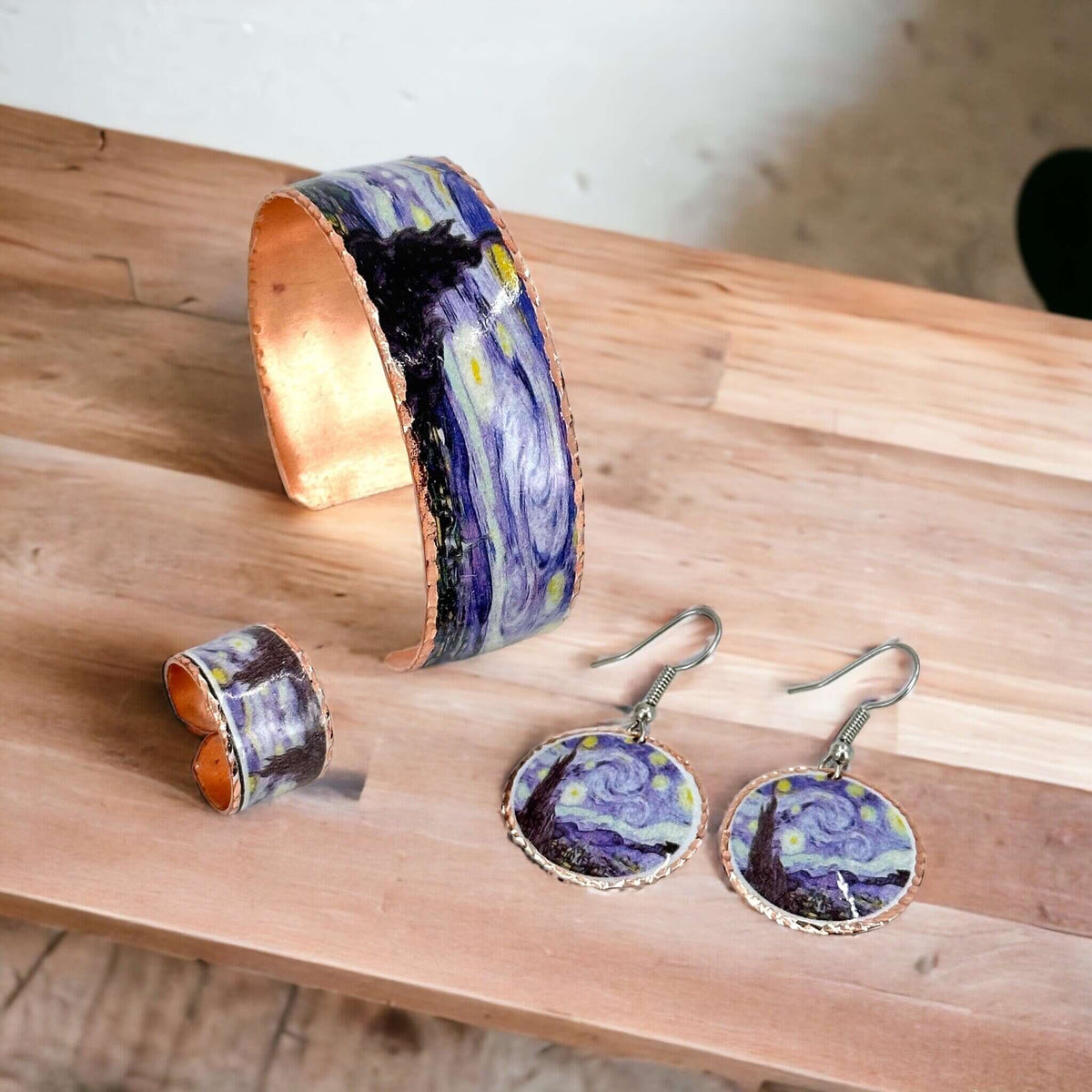 Individual pieces from three-piece Van Gogh Starry Night copper jewellery set arranged together