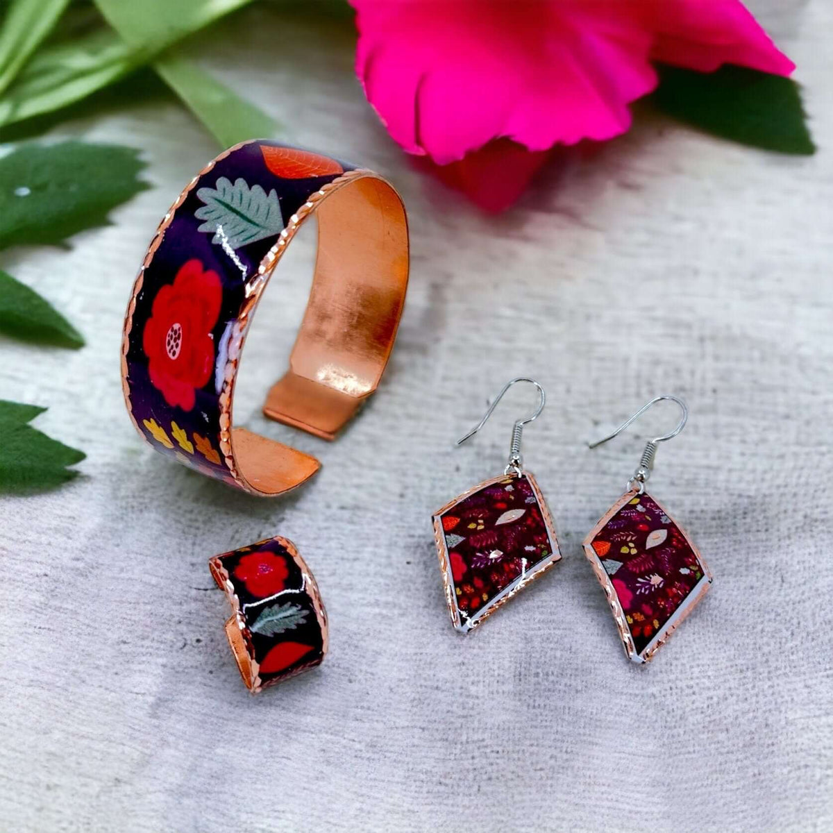 The full purple flowers copper jewellery set laid flat