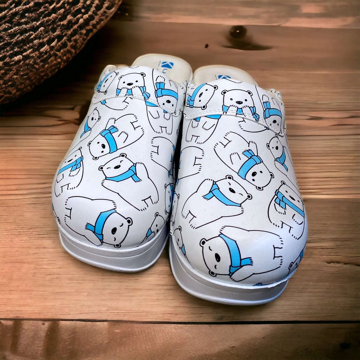 Handmade polar bear design leather clogs with an Air Clogx sole worn on the foot