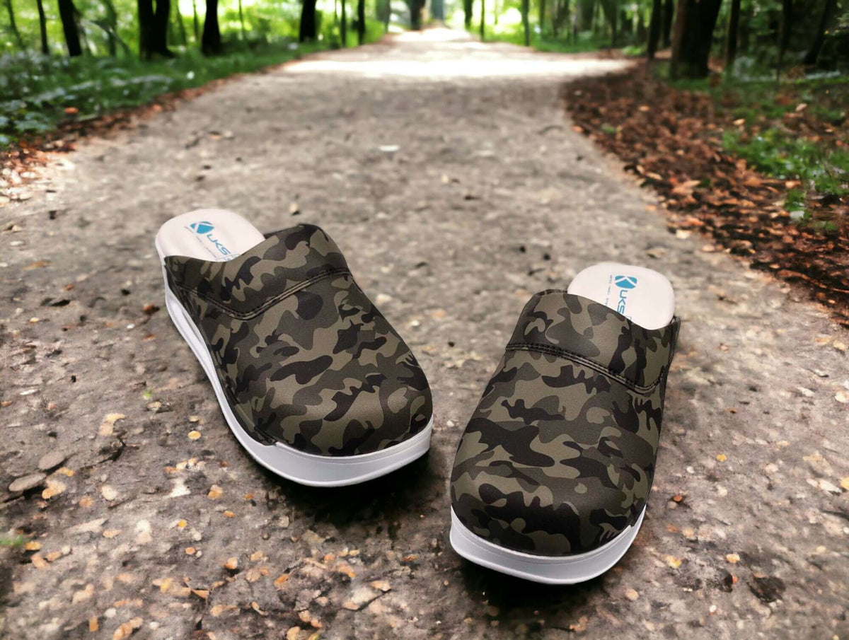 Sole and tread detail of camouflage leather clogs with a white Air Clogx sole