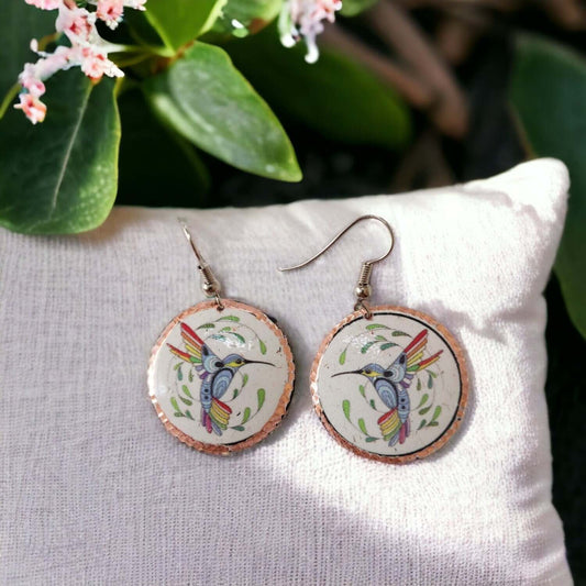 Front view of handcrafted hummingbird copper circle earrings