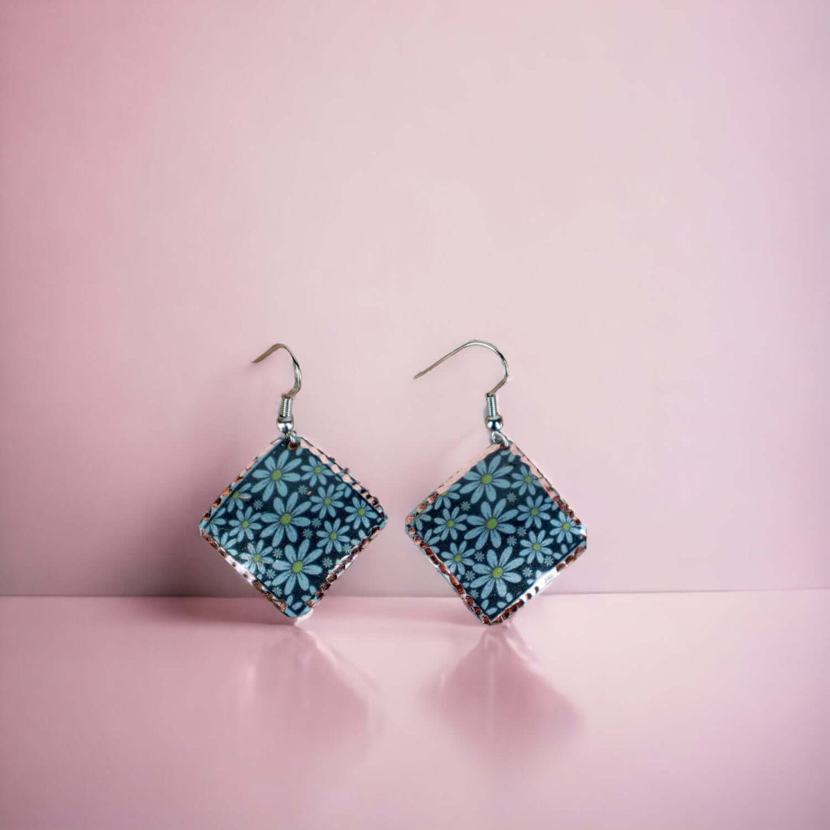 Artisan turquoise flower copper square earrings worn on the ear