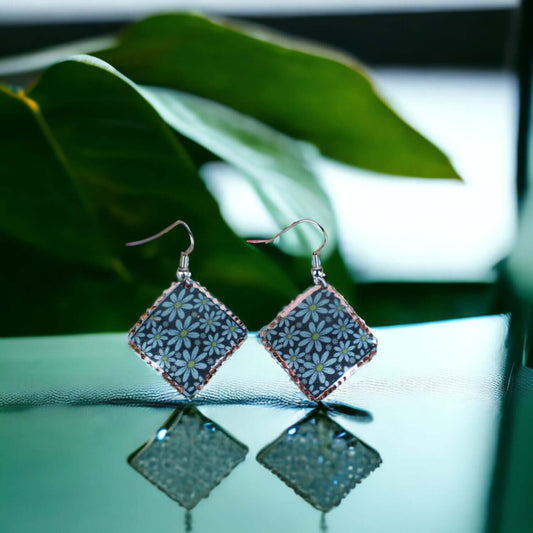 Close-up of the copper texture on artisan turquoise flower copper square earrings