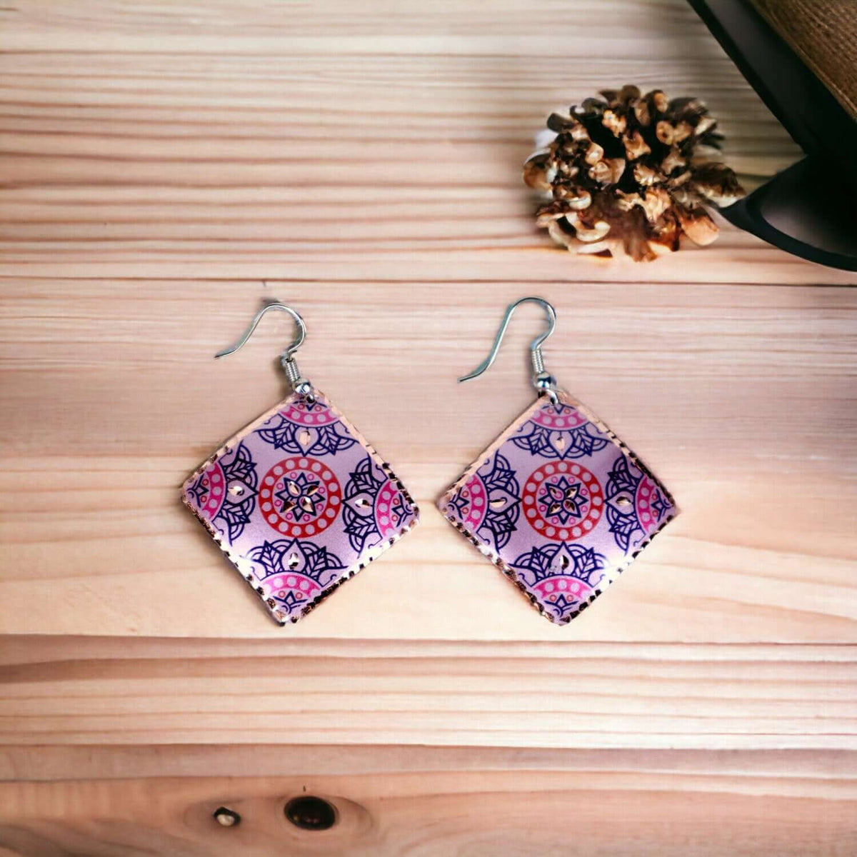 Close-up of the copper texture on handcrafted artisan pink copper square earrings