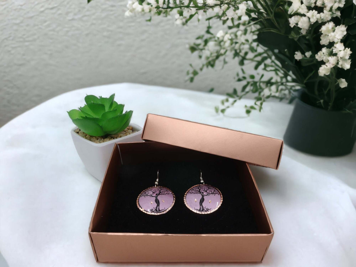 Close-up of the copper texture on handcrafted lavender tree copper circle earrings