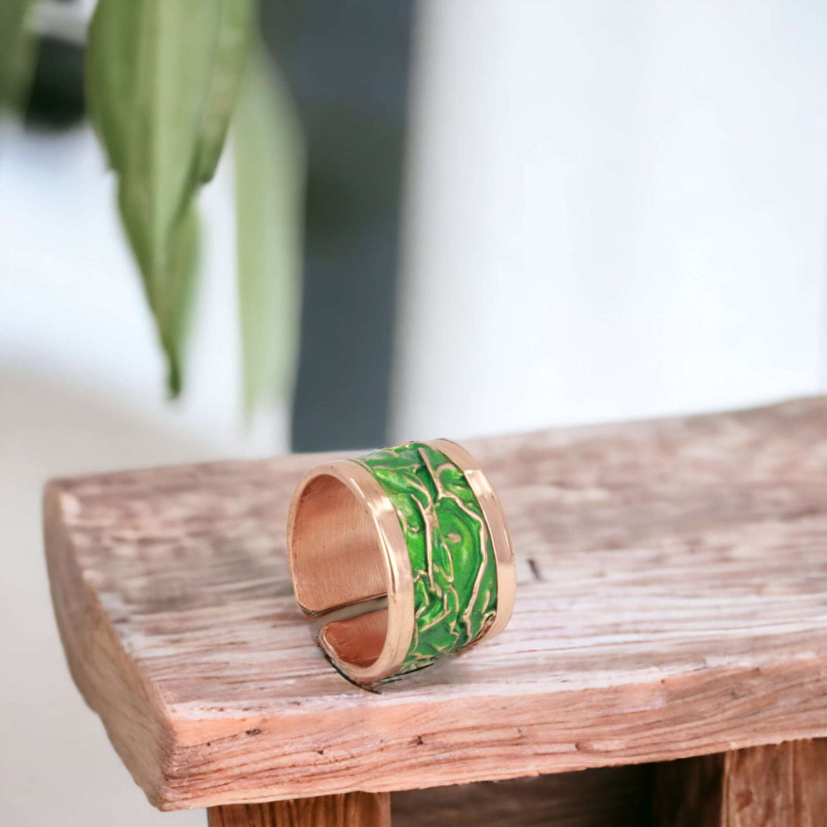 Handmade green wrinkled copper adjustable ring worn on the finger