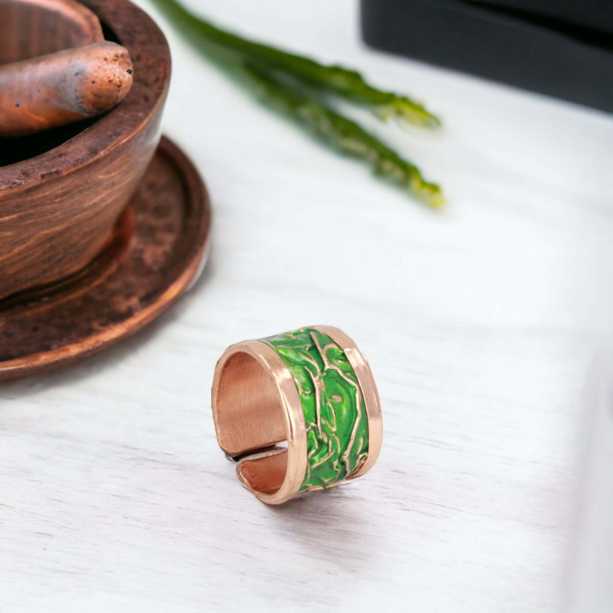 Close-up of the copper texture on handmade green wrinkled copper adjustable ring