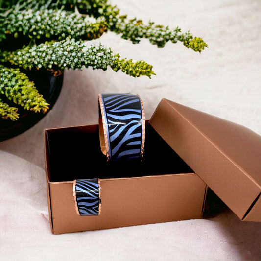 The full adjustable blue copper ring and bracelet jewellery set laid flat