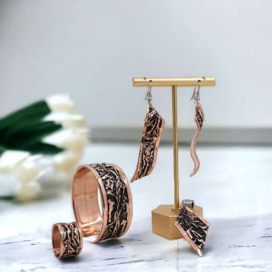The full handcrafted black wrinkled copper jewellery set laid flat