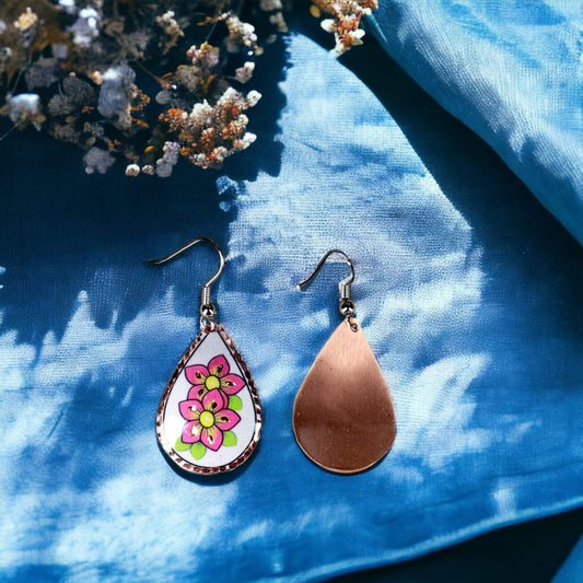 Front view of handcrafted pink flower copper drop earrings