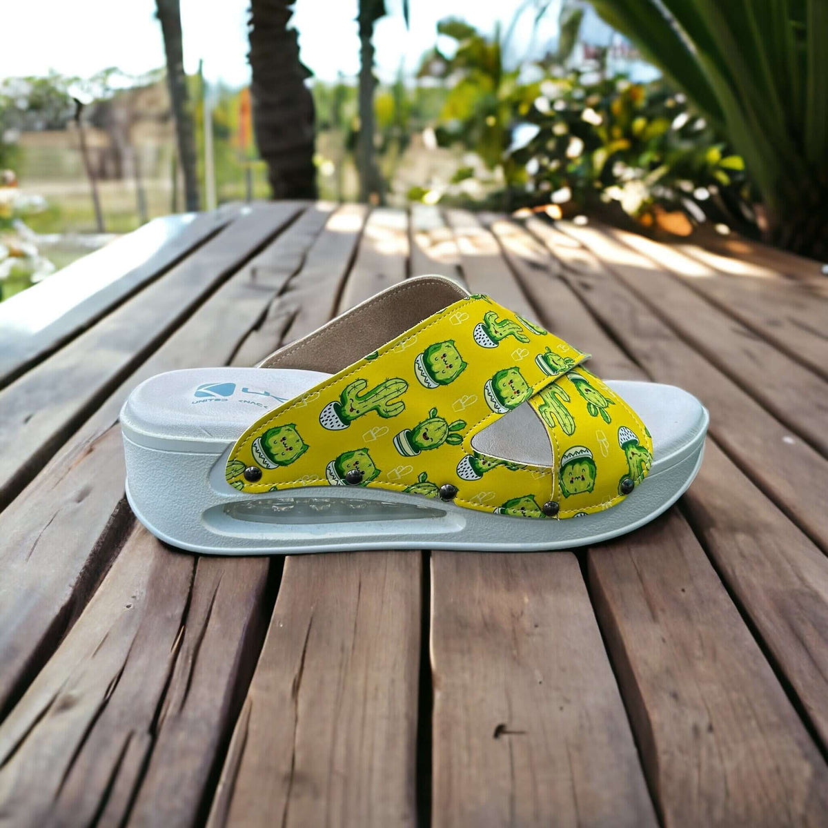 Sole and tread detail of cactus print cross band leather clog slippers with an Air Clogx sole