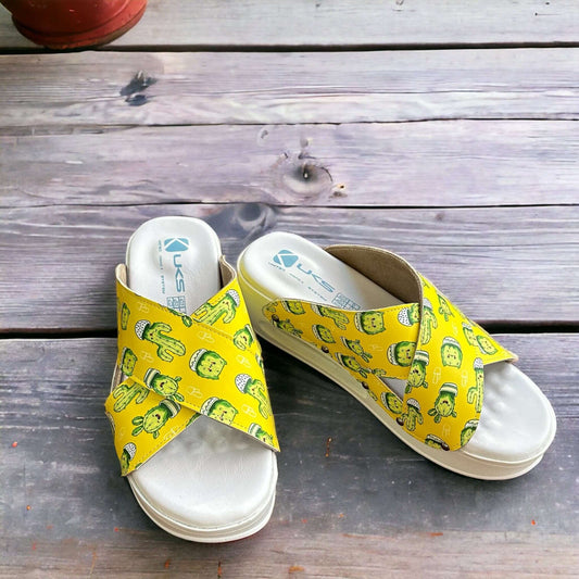 Side profile of cactus print cross band leather clog slippers with an Air Clogx sole