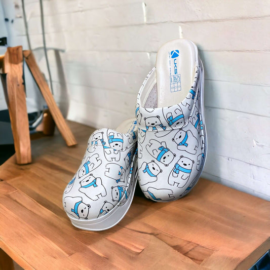 Side profile of handmade polar bear design leather clogs with an Air Clogx sole