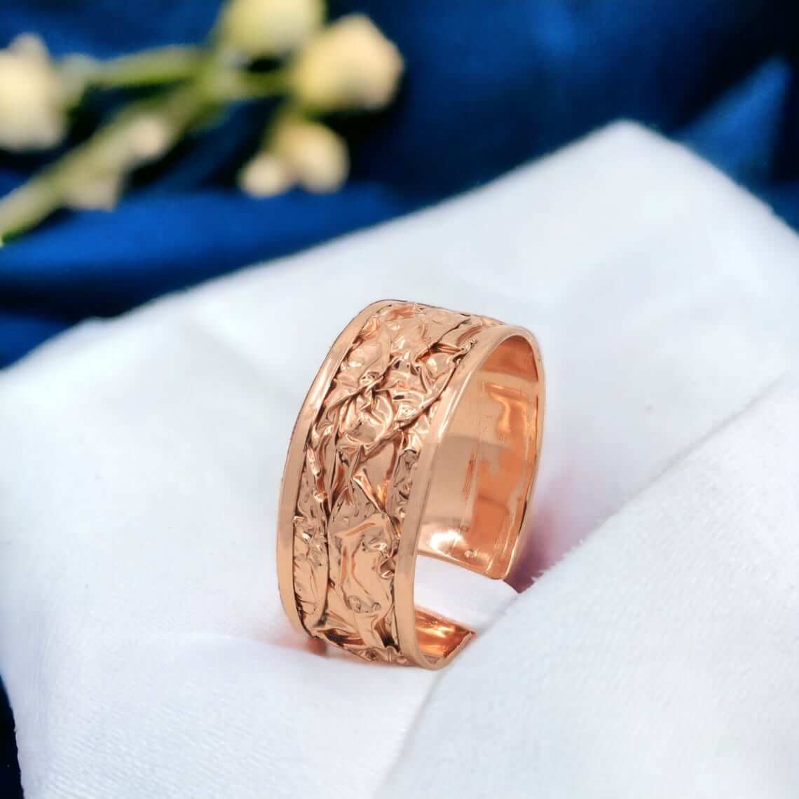 Close-up of the copper texture in handcrafted wrinkled copper jewellery set