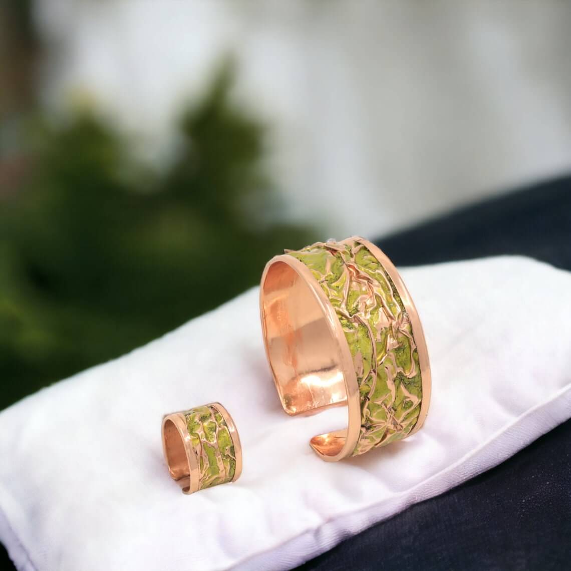 Side angle of four-piece yellow wrinkled copper jewellery set