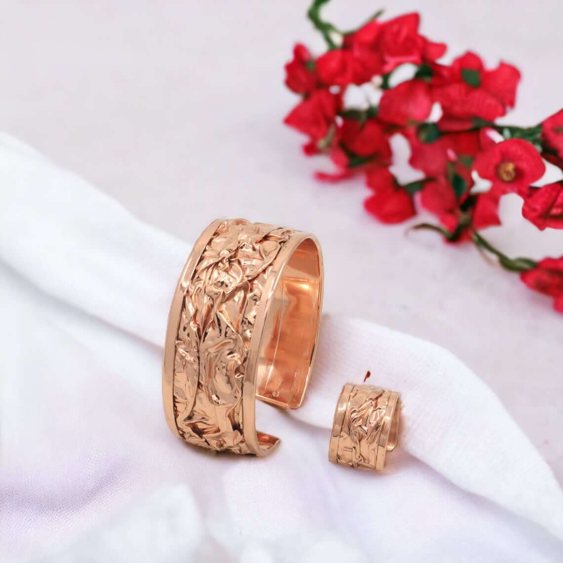 Front view of handcrafted wrinkled copper jewellery set
