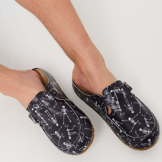 Front view of unisex orthopedic vegan skeleton print clog slippers