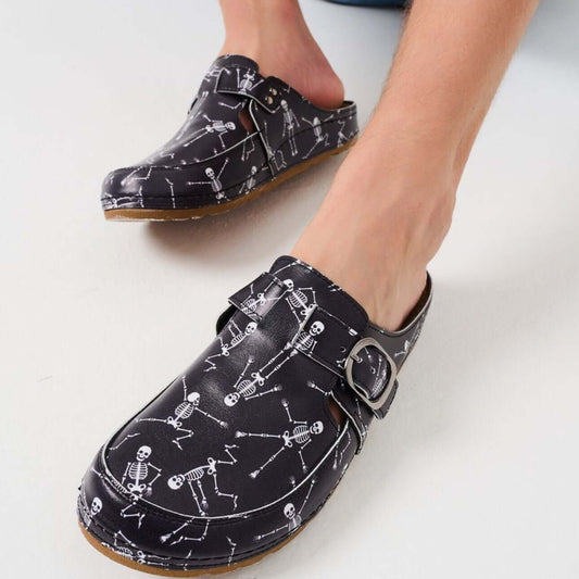 Side profile of unisex orthopedic vegan skeleton print clog slippers